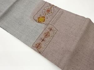 手織り紬汕頭相良刺繍変わり横段に抽象華紋・花々模様名古屋帯